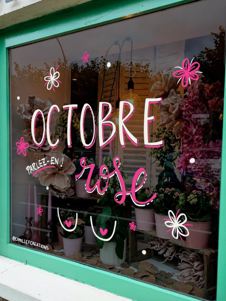 Peinture sur Vitrine pour Octobre Rose réalisée à Saint-Arnoult-en-Yvelines sur la vitrine de la fleuriste MDesign.