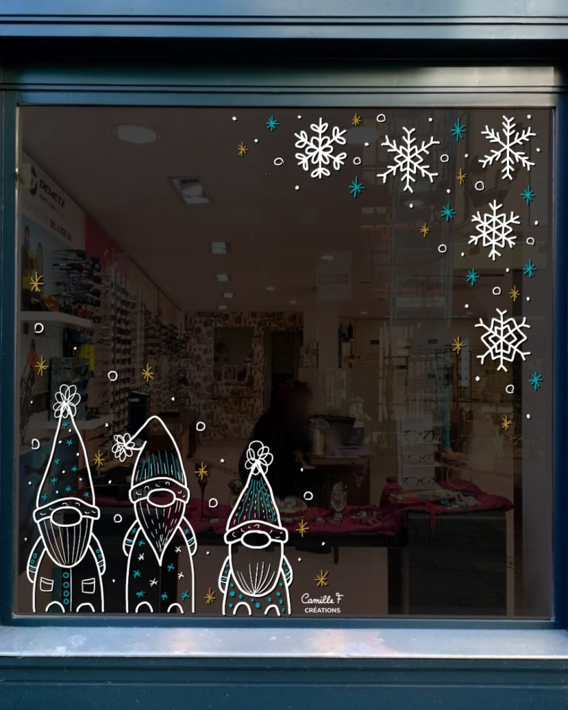 Peinture sur vitrine pour Noël représentant des lutins de Noël et des flocons de neige. Design par Camille F créations