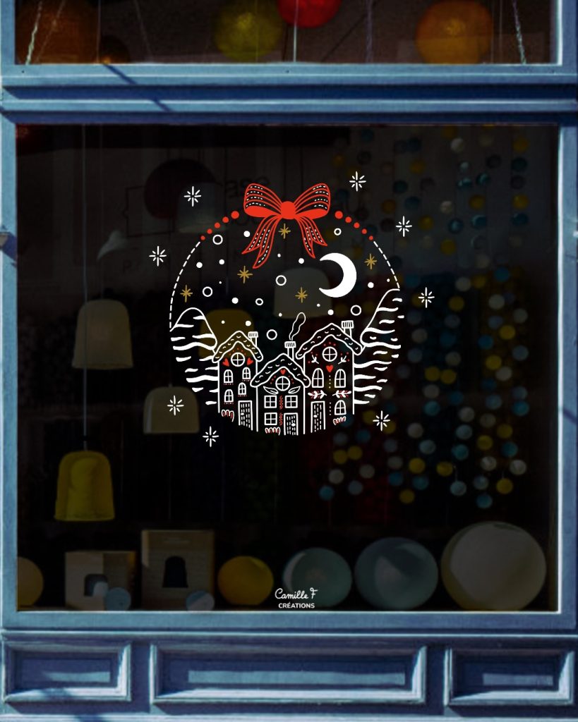 Peinture sur vitrine représentant une boule de Noël avec un village enneigé