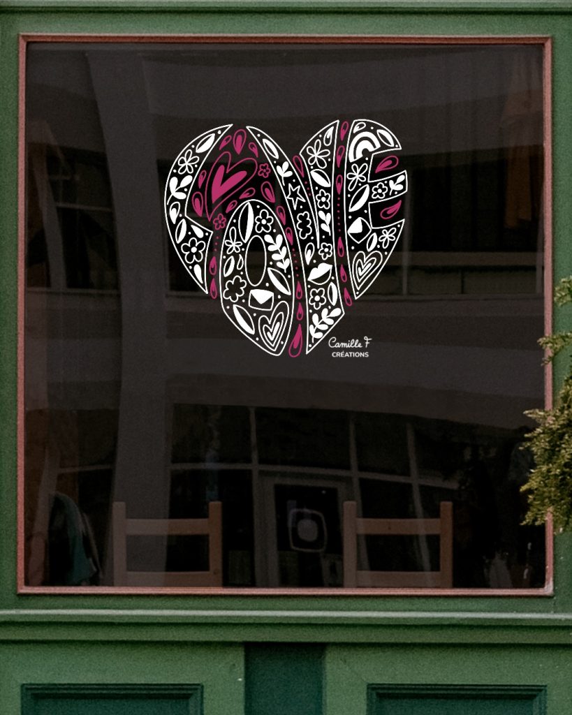 Peinture sur vitrine représentant le mot LOVE en forme de cœur. Design par Camille F créations
